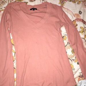 A pink long sleeve top
